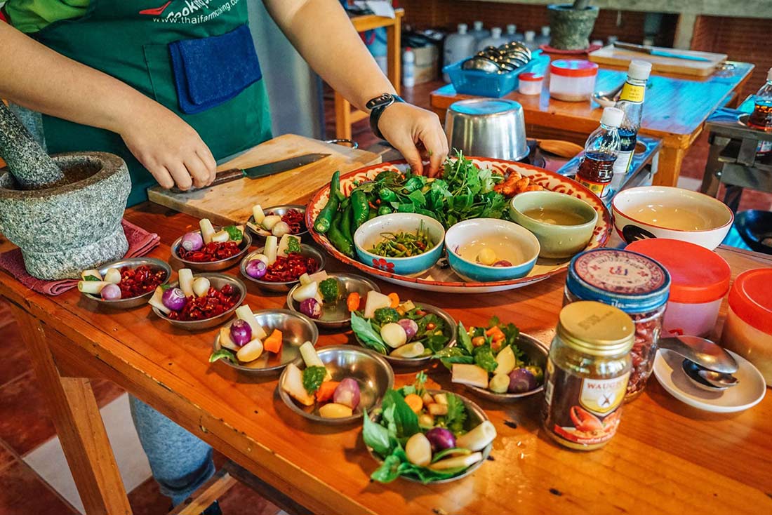 Illustrated cooking class with students preparing fresh ingredients